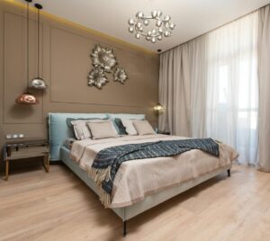 Elegant bedroom interior showcasing modern design and artistic decor elements in a well-lit space.