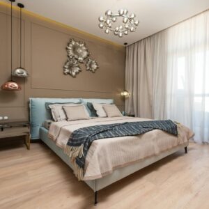 Elegant bedroom interior showcasing modern design and artistic decor elements in a well-lit space.